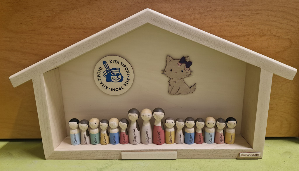 Häuschen mit Teamfiguren